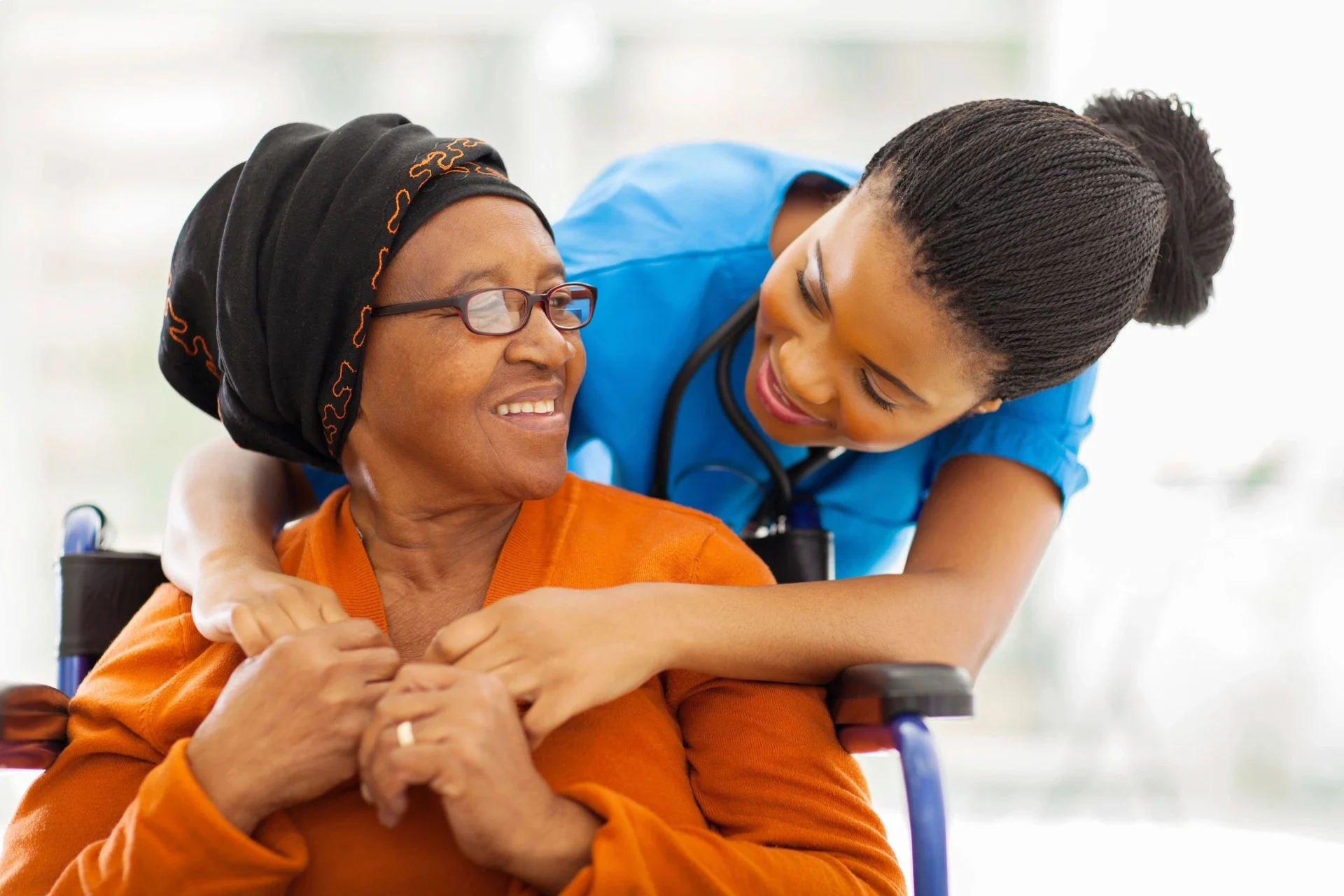 a nurse taking care of an old lady