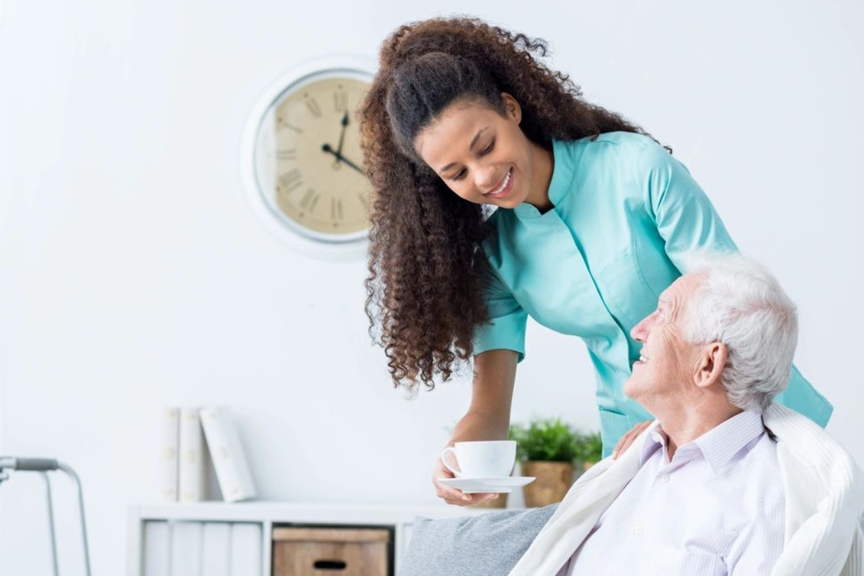 a nurse taking care of an old man