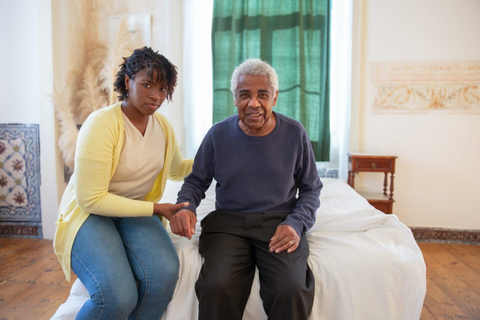 a nurse taking care of the old man